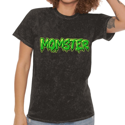 Person wearing a black t-shirt with 'MOMSTER' in green letters on a white background