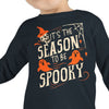 Child wearing a black long-sleeve shirt with Halloween-themed text and graphics on a white background